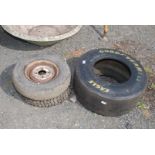 A Good Year racing car tyre 25.5 x 9.5. x 13 and two mini tyres; including one Mud & Snow tyre.