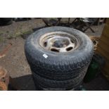 Four wheels and tyres (2 part worn) 235/75 R15.