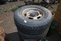 Four wheels and tyres (2 part worn) 235/75 R15.