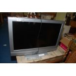 A Sony Bravia TV, 31" screen, with remote.