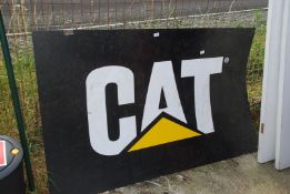 A large plastic 'CAT' sign, 40" x 63".