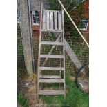 A 6 rung wooden step ladder.