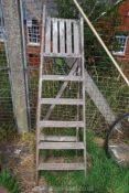 A 6 rung wooden step ladder.