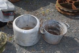 An aluminium saucepan and a galvanised two handled pail.