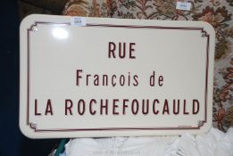 An enamel sign 'Rue Francois de la Rochefoucauld'.