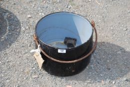 An enamel cook pot.