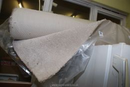 A roll of cream carpet 2.4m x 4m.
