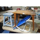 A wooden folding occasional table, adjustable bed backrest and two stools.