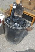 A bin of black PVC deep flow and other guttering.