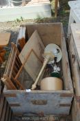 A large old wooden chest having iron handles and brackets plus contents.