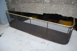 A brass and mesh fire fender, 45'' wide x 12'' high x 11'' deep.