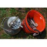 A stainless steel dump bucket and other milking equipment.