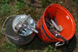 A stainless steel dump bucket and other milking equipment.