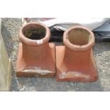 A pair of terracotta chimney pots 14" high x 12 1/2" square.