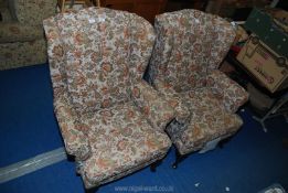 A pair of cottage armchairs.