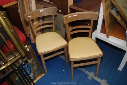 Two kitchen chairs.