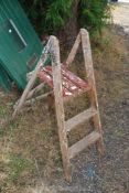 A two rung wooden step ladder.