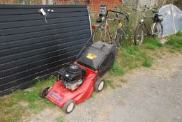 A Lawn-King Sovereign lawn mower with grass collecting box, self-propelled (engine runs).