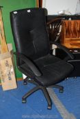 A black swivel office chair.