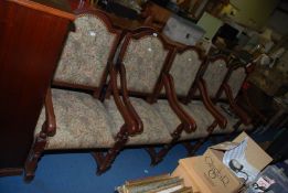 Ten tapestry fabric upholstered carver type dining chairs.