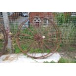 Two metal framed cartwheels 44" diameter.