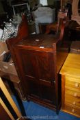 A dark wooden cupboard with shelves 22" wide x 16 1/2" deep x 53" high.