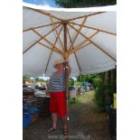 A large cotton garden parasol (canvas marked).