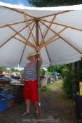 A large cotton garden parasol (canvas marked).