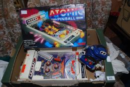 A Tomy Robot alarm clock and Tomy pinball game.