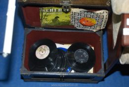 A box of 45 records.