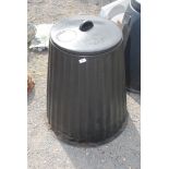 A lidded compost bin.