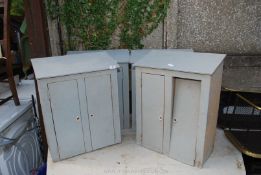 Four wooden lockers.