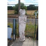 A large concrete semi nude female garden figure, 64" tall.