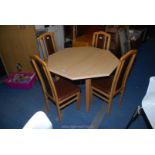 An octagonal table with 4 chairs, 43" x 29 1/2" high.