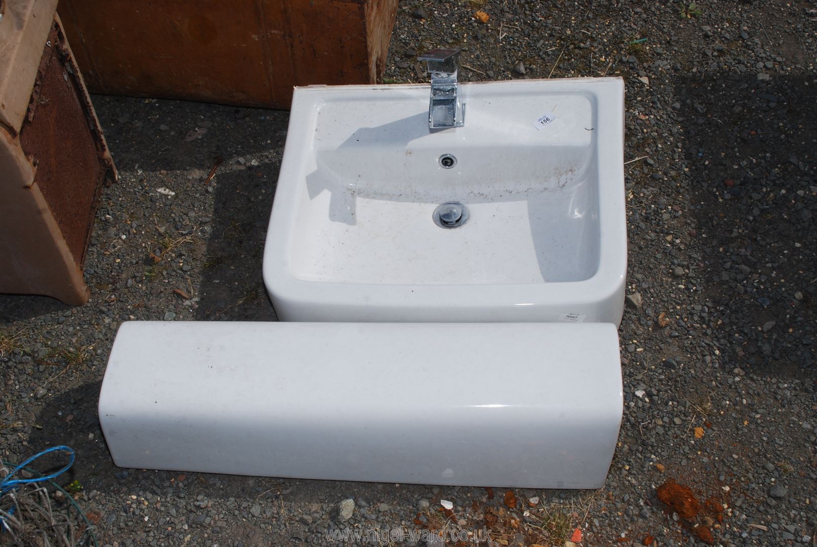 A hand basin with pedestal and tap.