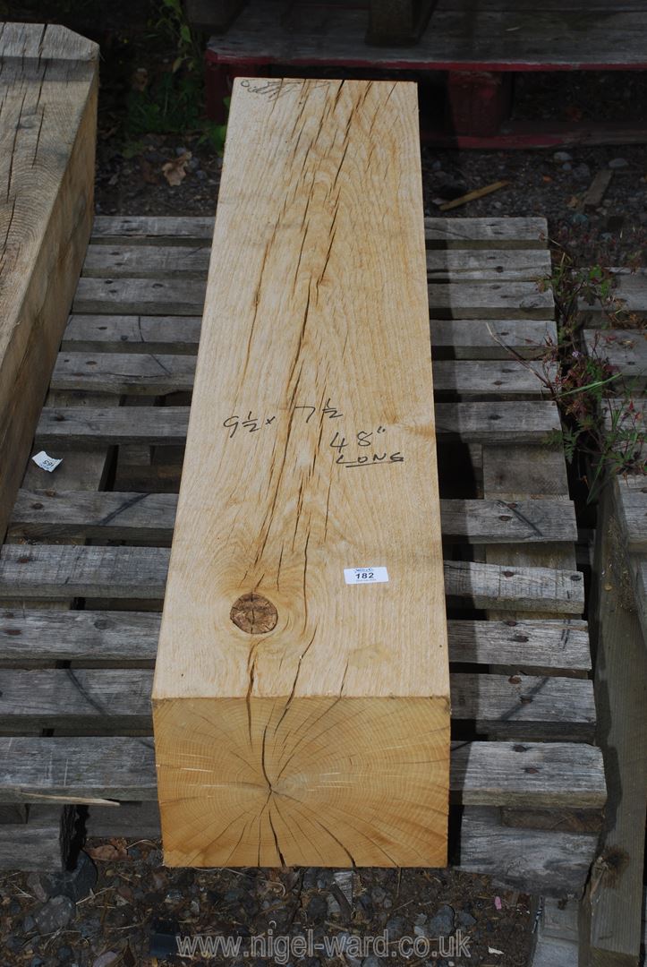 A piece of oak 9 1/2" x 7 1/2" x 48" long.