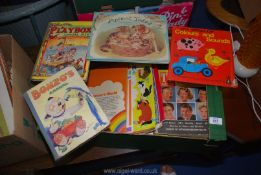 A box of children's books and annuals.