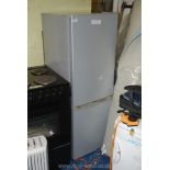 A silver fridge freezer 56" high x 20" wide x 22" deep.