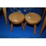 Two elm three legged 'milking' stools 13" tall.