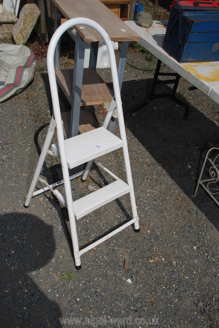 A set of white metal steps.