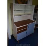 A 70's kitchen cupboard 3' wide x 15" deep x 58 1/2" high.