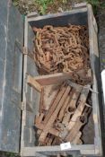 A wooden crate with iron chain, mole traps, etc.