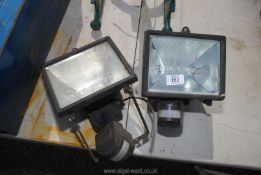 Two flood lights with sensors.