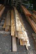 A quantity of mixed boards, some decking new and unused.