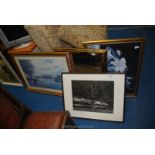 Two prints, a black and white photograph of a tree and a mirror.