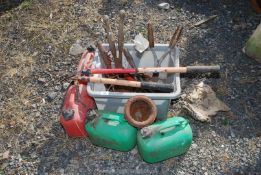 Garden tools and fuel cans.