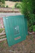 A green painted external stable type door.