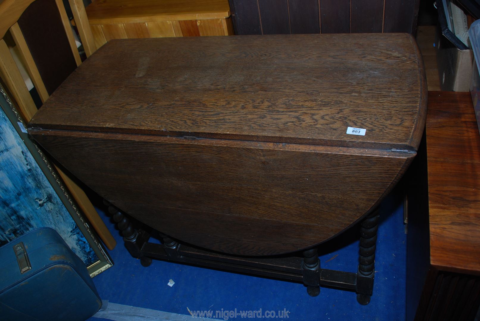 A drop leaf table with barley twist legs 41 1/2" x 58" long (incl. leaves).