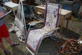 A metal framed canvas reclining chair.