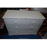 A white painted chest of 3 drawers, 46" long x 35" high x 19" deep.